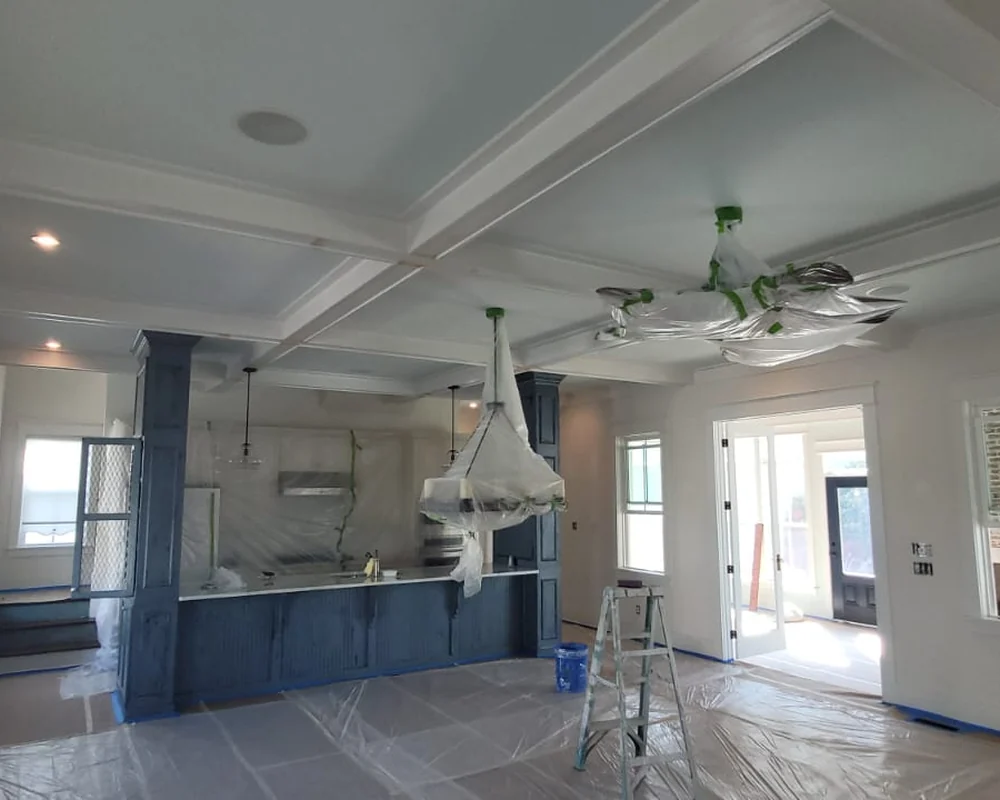 Bright interior room with covered floors and prepared surfaces