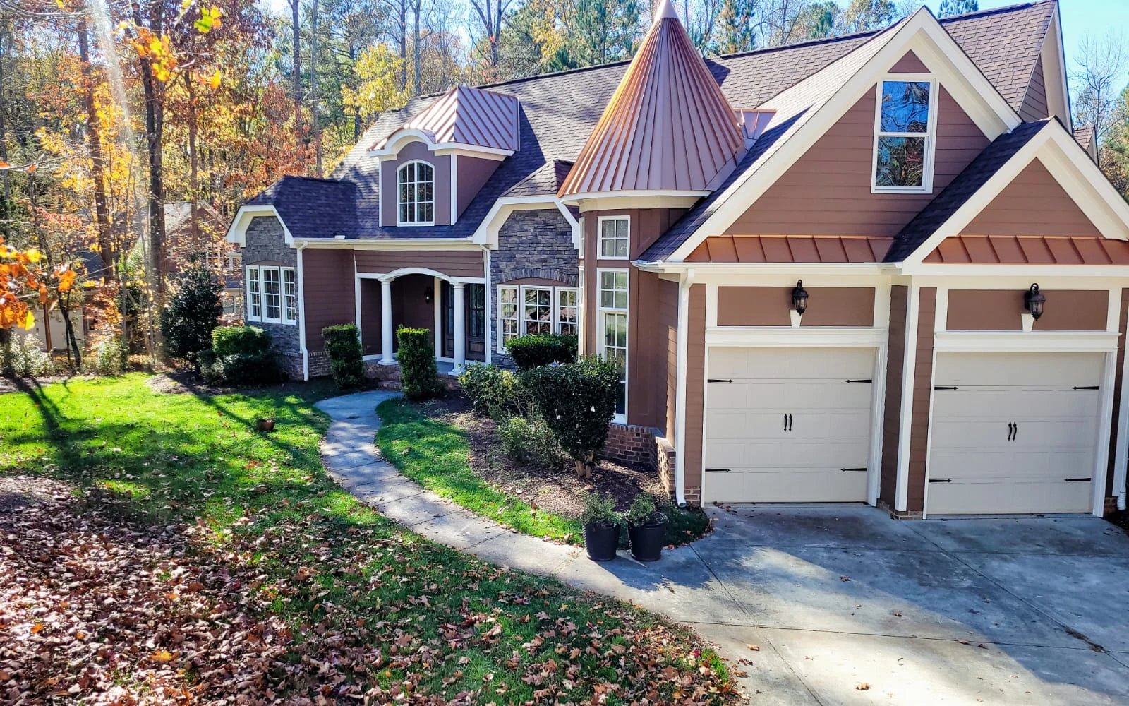 House exterior with gables and a driveway